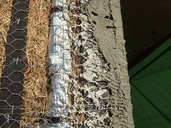 Chicken wire used for plastering to a straw wall