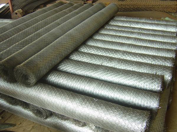 Expanded plaster mesh rolls neatly arranged in warehouse