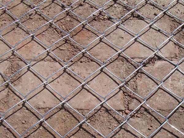 A piece of galvanized plaster chain link mesh